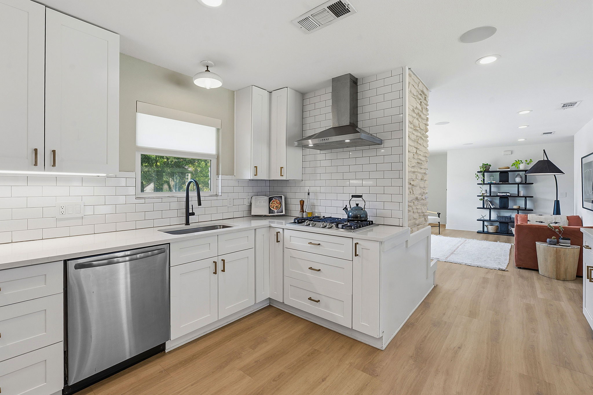 4403 Elmsgrove Drive Austin, TX 78721 - Photo 26 of 38 A pristine culinary space flows seamlessly into a spacious living area, ideal for effortless entertaining.