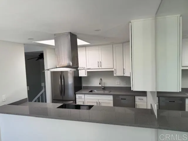 a view of empty room with wooden floor and fireplace