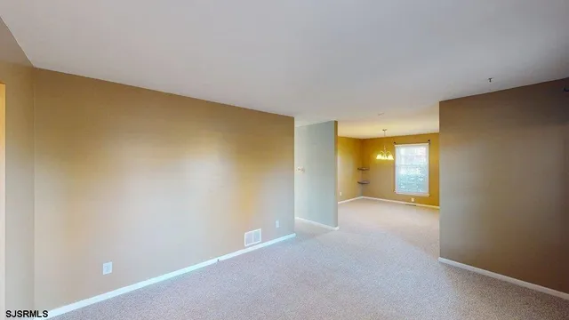 a view of a yard with large trees