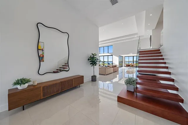a view of a chairs and tables in the balcony