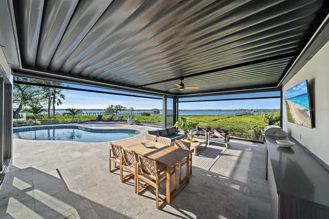 a bathroom with a sink a toilet a mirror and shower