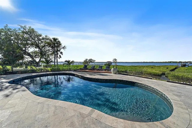 a bedroom with furniture and a flat screen tv