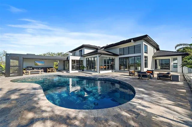 a view of a swimming pool with a patio