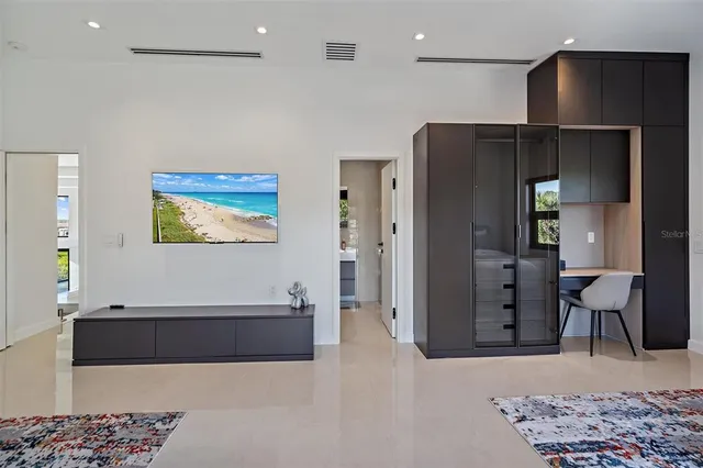 a room with wooden floor and large window