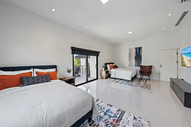 a bathroom with a potted plant and a sink