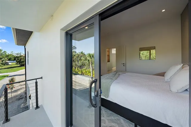 a bedroom with a bed and a painting