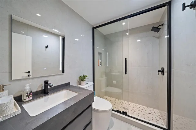 a bedroom with a large bed and a large window