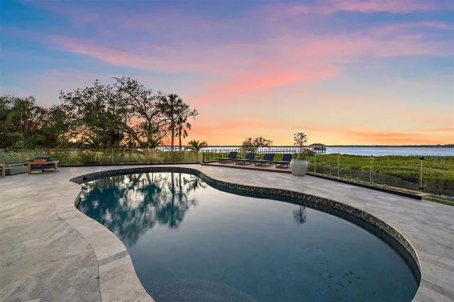 a living room with furniture large window and a flat screen tv