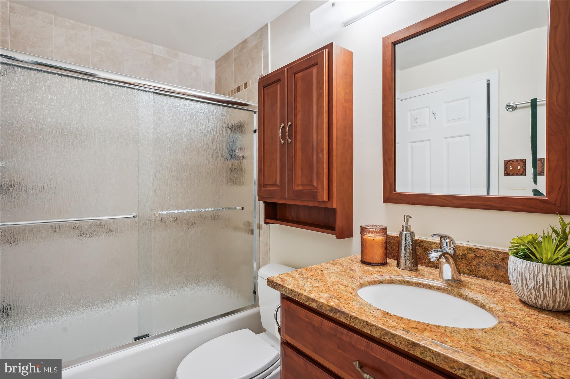 924 Pointer Ridge Drive Gaithersburg, MD 20878 - Photo 32 of 85 Updated Hall Bath w/Ceramic Tile & Glass Tub Doors