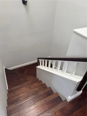 a view of wooden floor with a small space