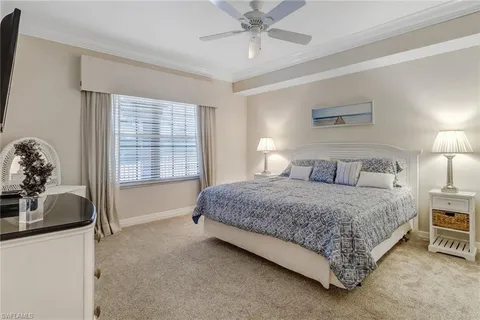 a spacious bedroom with a bed and a couch