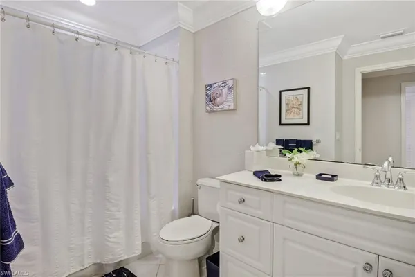 a bathroom with a sink toilet and vanity