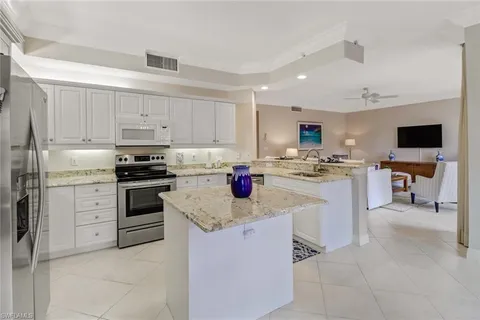 a kitchen with cabinets and appliances