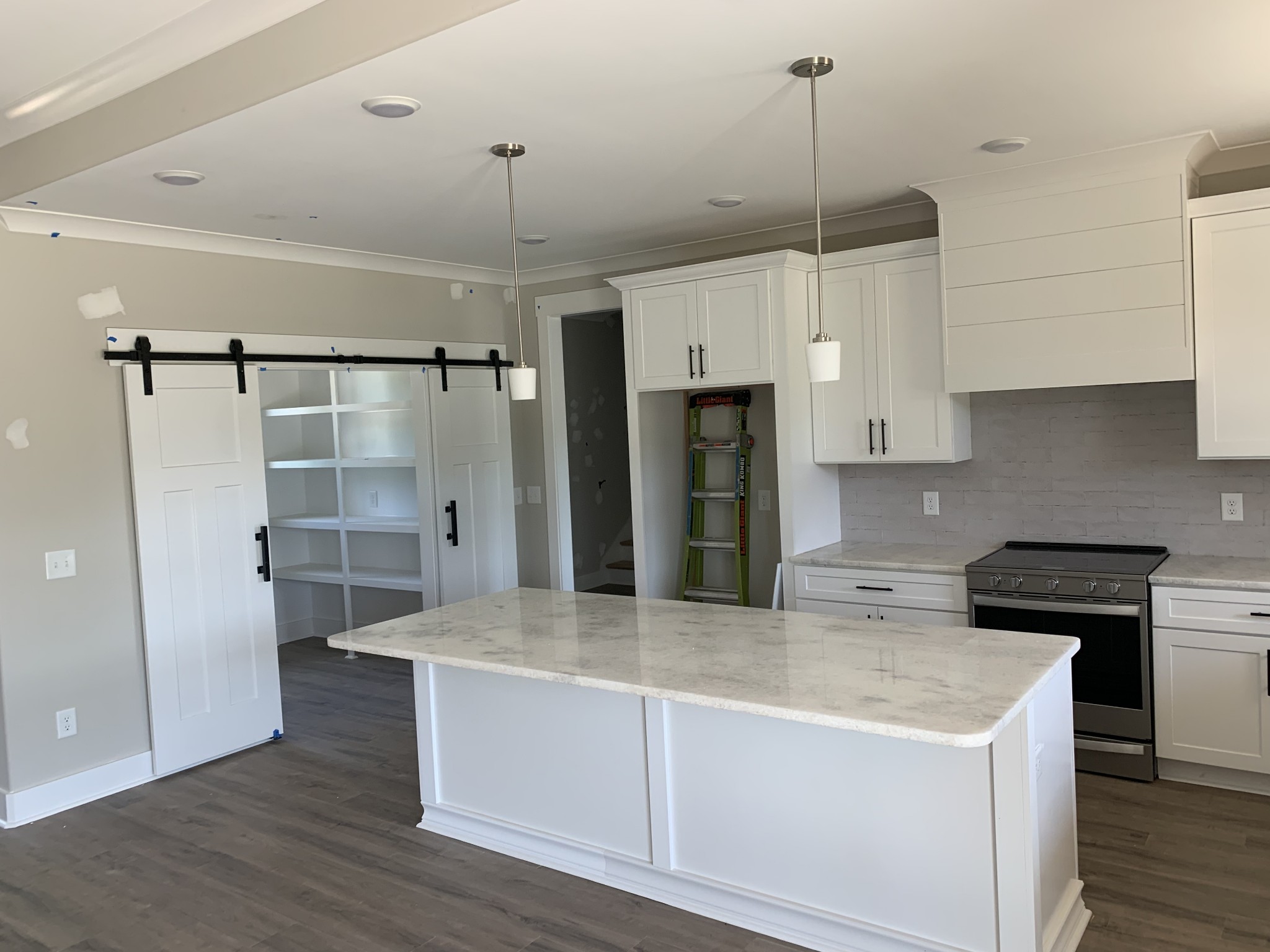 1798 Old Gallatin Road Portland, TN 37148 - Photo 11 of 35 a kitchen with kitchen island a counter top space appliances and cabinets