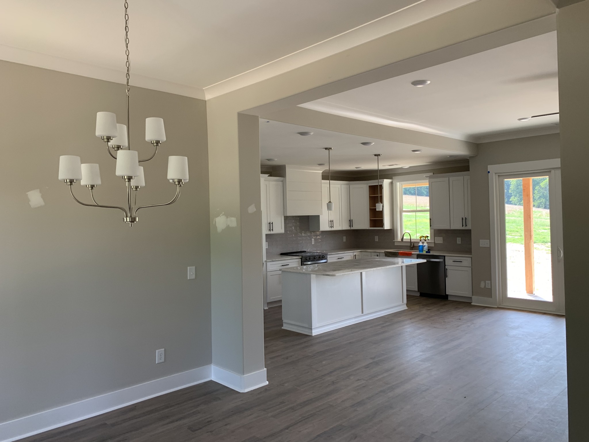 1798 Old Gallatin Road Portland, TN 37148 - Photo 8 of 35 a large kitchen with a wooden floor and stainless steel appliances