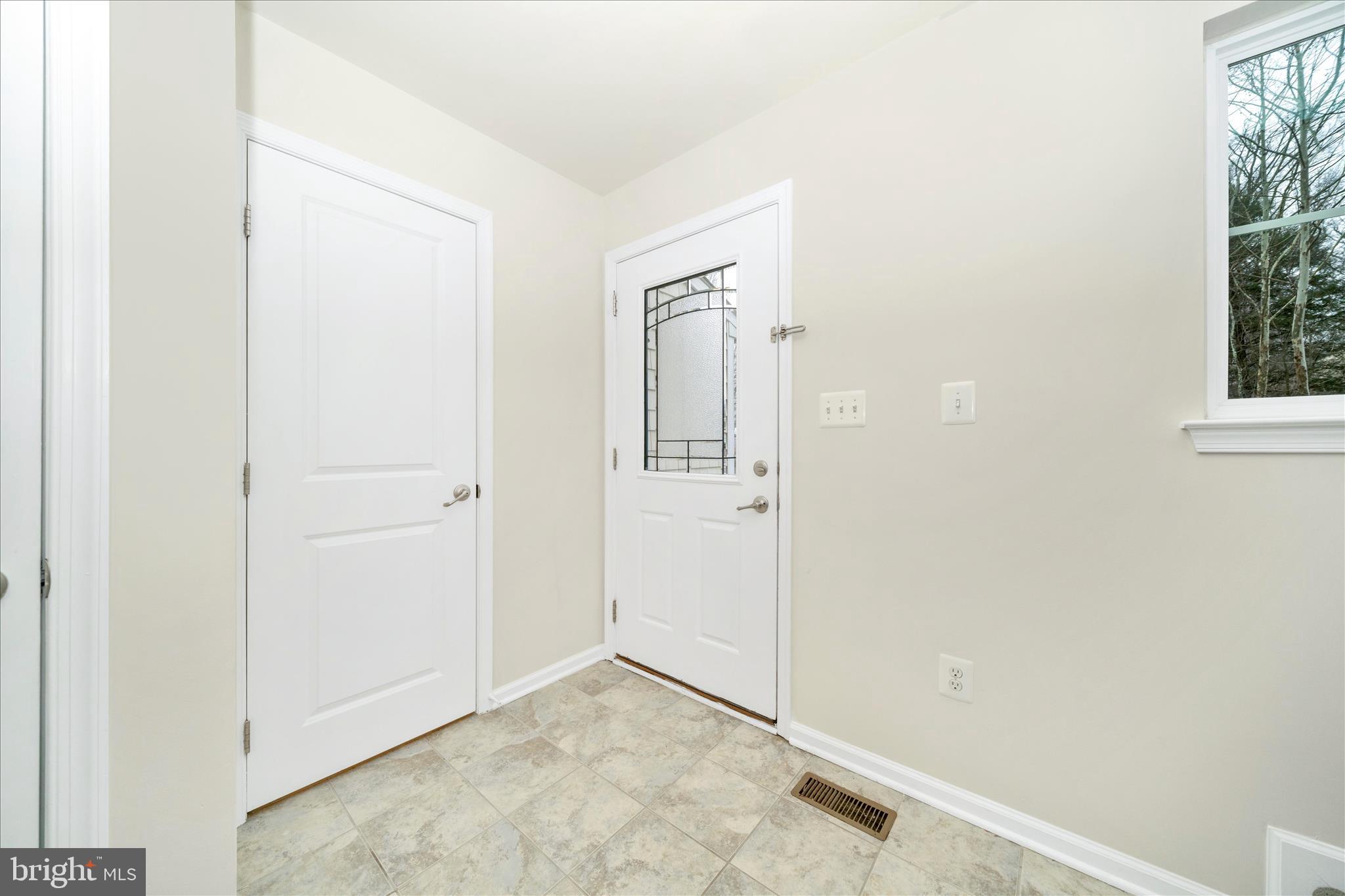 7014 Linden Avenue Elkridge, MD 21075 - Photo 8 of 42 an empty room with windows