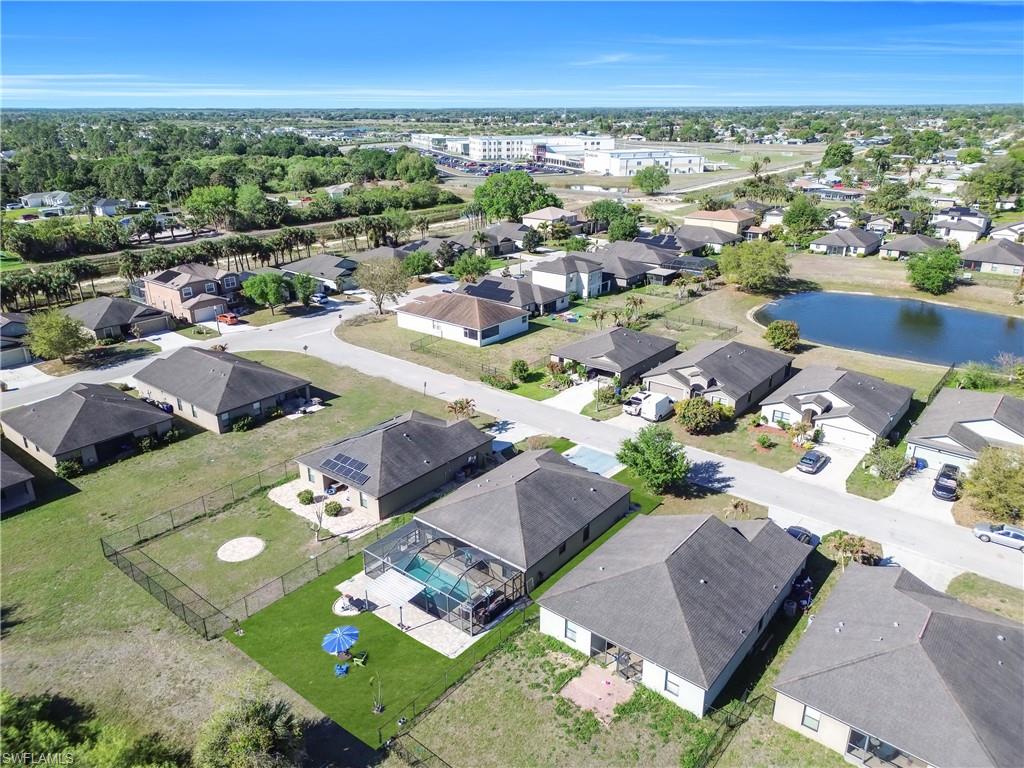 175 Shadowview Court Lehigh Acres, FL 33974 - Photo 37 of 39 an aerial view of a city with lots of residential buildings