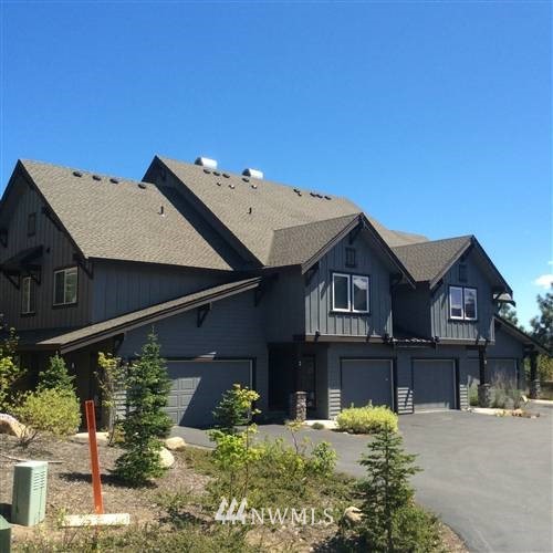 a view of a house with wooden fence