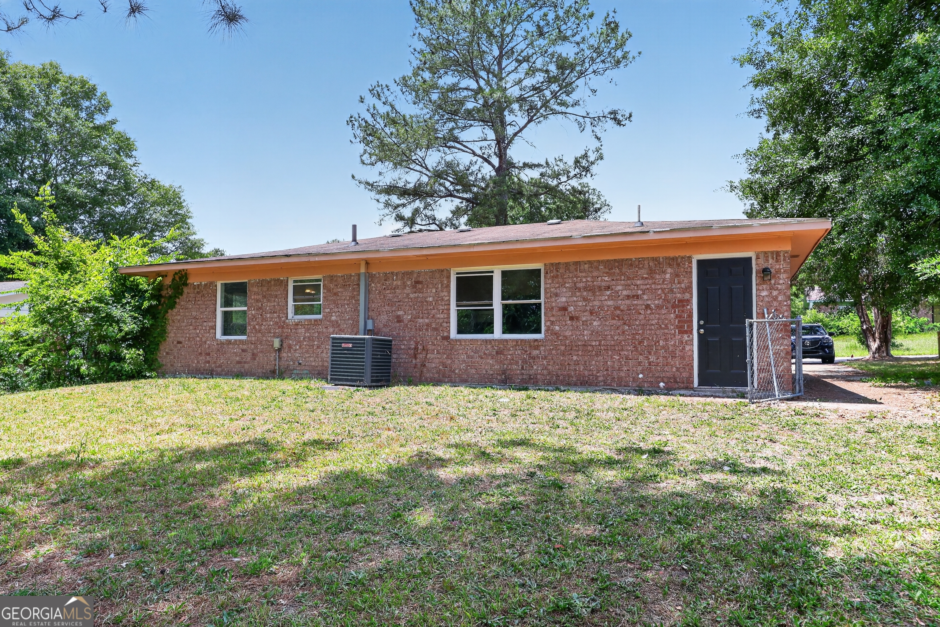 3606 Alene Circle Augusta, GA 30906 - Photo 28 of 30 a backyard of a house with large trees