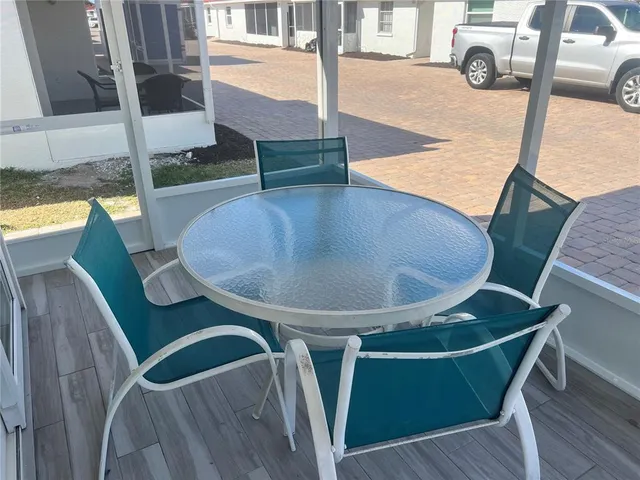 a view of kitchen with furniture and wooden floor