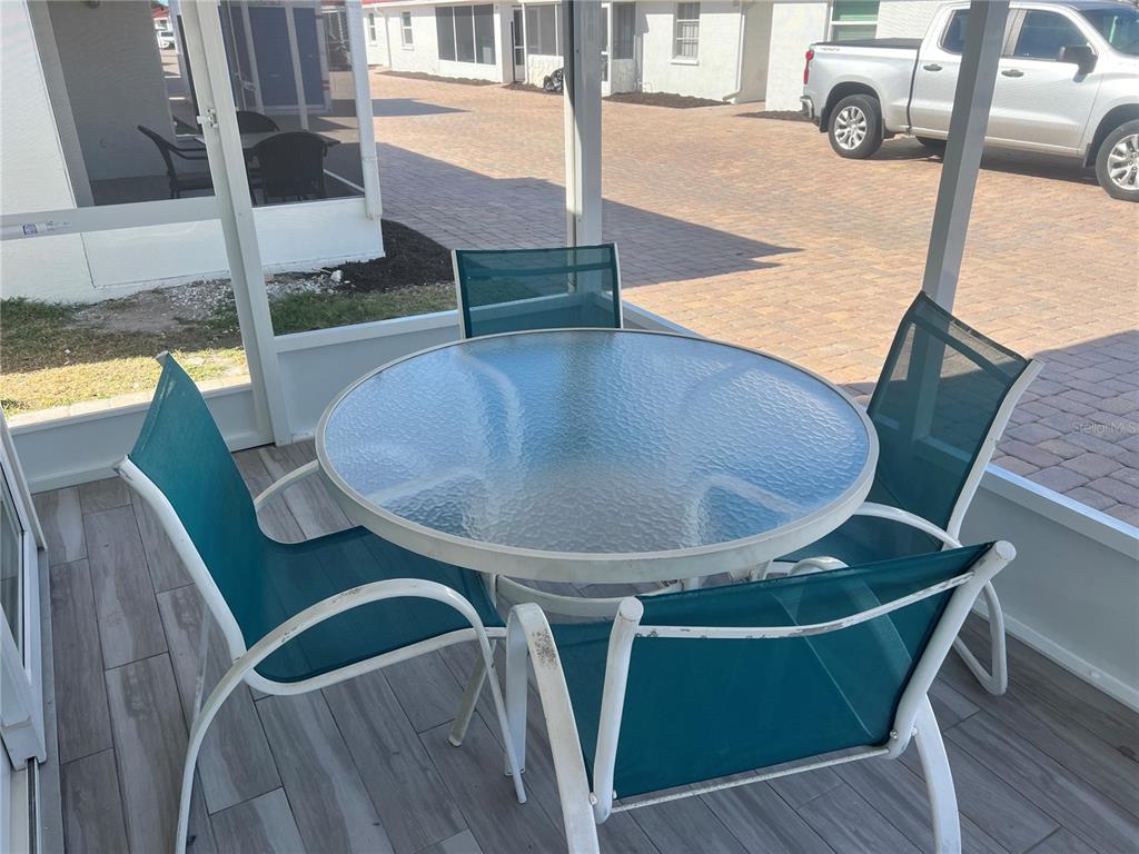 6154 Midnight Pass Road, Unit B03 Sarasota, FL 34242 - Photo 11 of 11 a view of kitchen with furniture and wooden floor