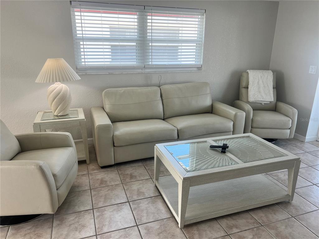6154 Midnight Pass Road, Unit B03 Sarasota, FL 34242 - Photo 5 of 11 a living room with furniture and a window
