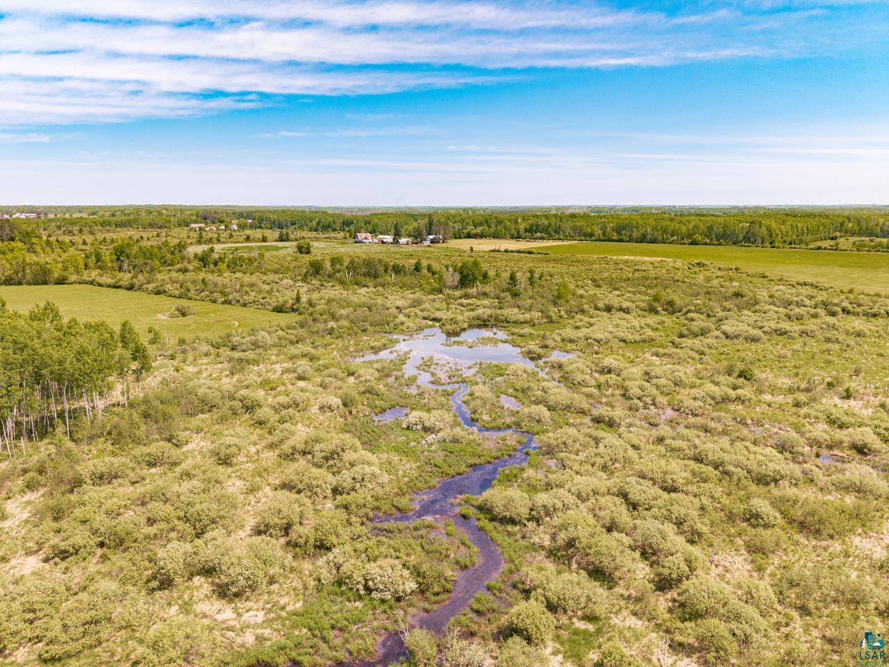 6606 Metso Road Kettle River, MN 55757 - Photo 56 of 84 Expansive natural landscape featuring varied terrain, including a winding water feature and lush green foliage