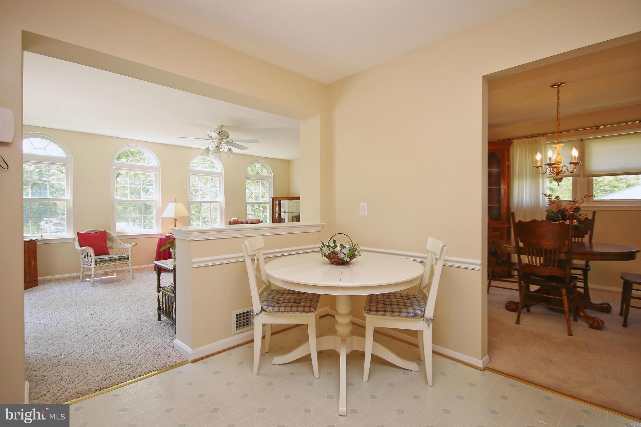 7927 Ellet Road Springfield, VA 22151 - Photo 11 of 30 a view of a dining room with furniture and a livingroom