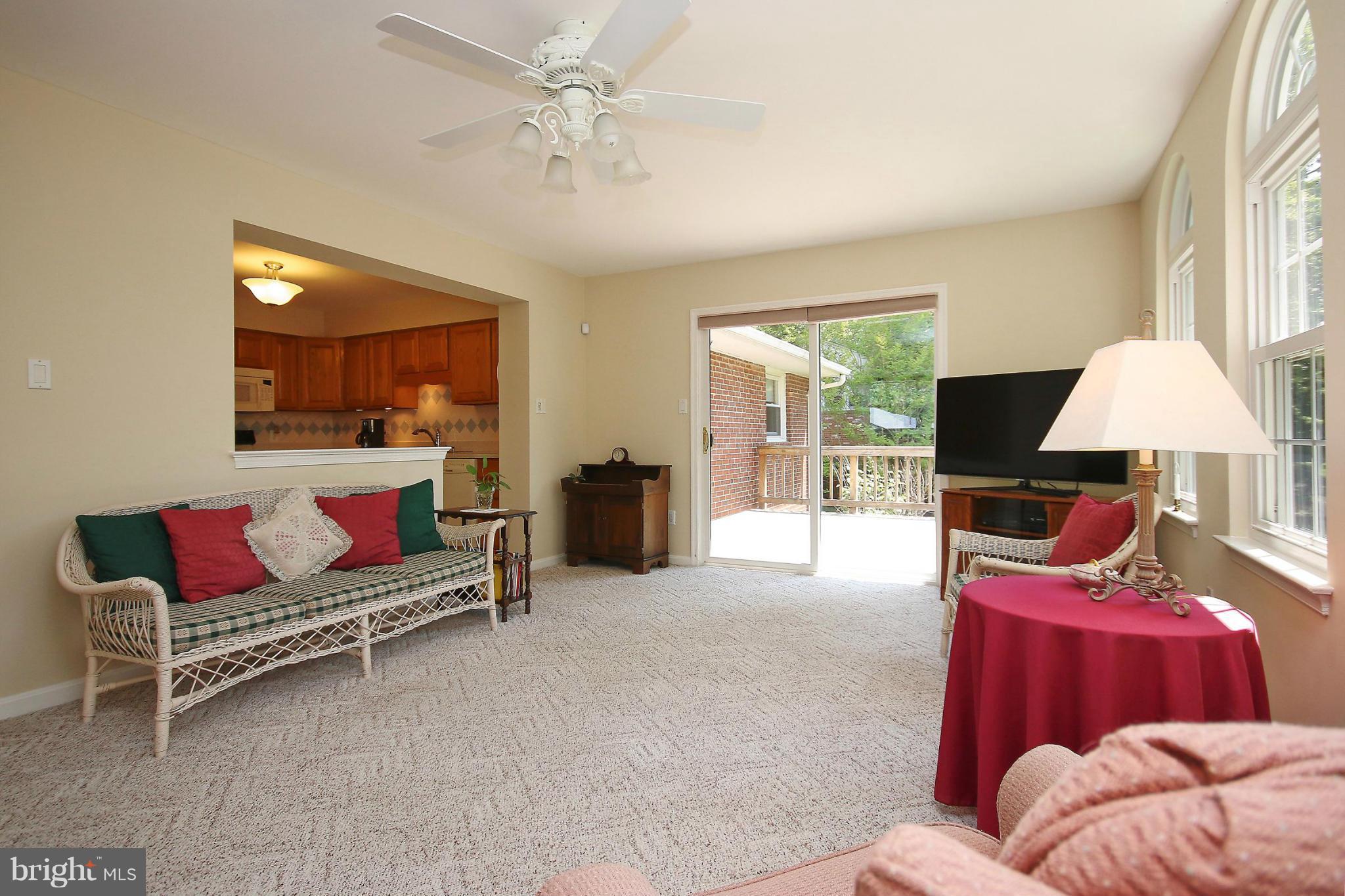7927 Ellet Road Springfield, VA 22151 - Photo 13 of 30 a living room with furniture a rug and a chandelier