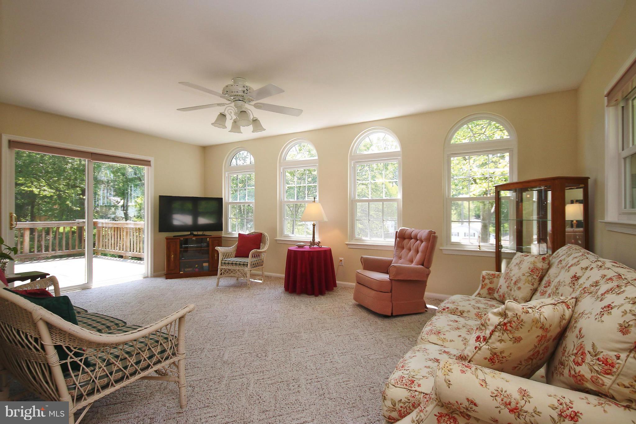 7927 Ellet Road Springfield, VA 22151 - Photo 14 of 30 a living room with furniture and a fireplace