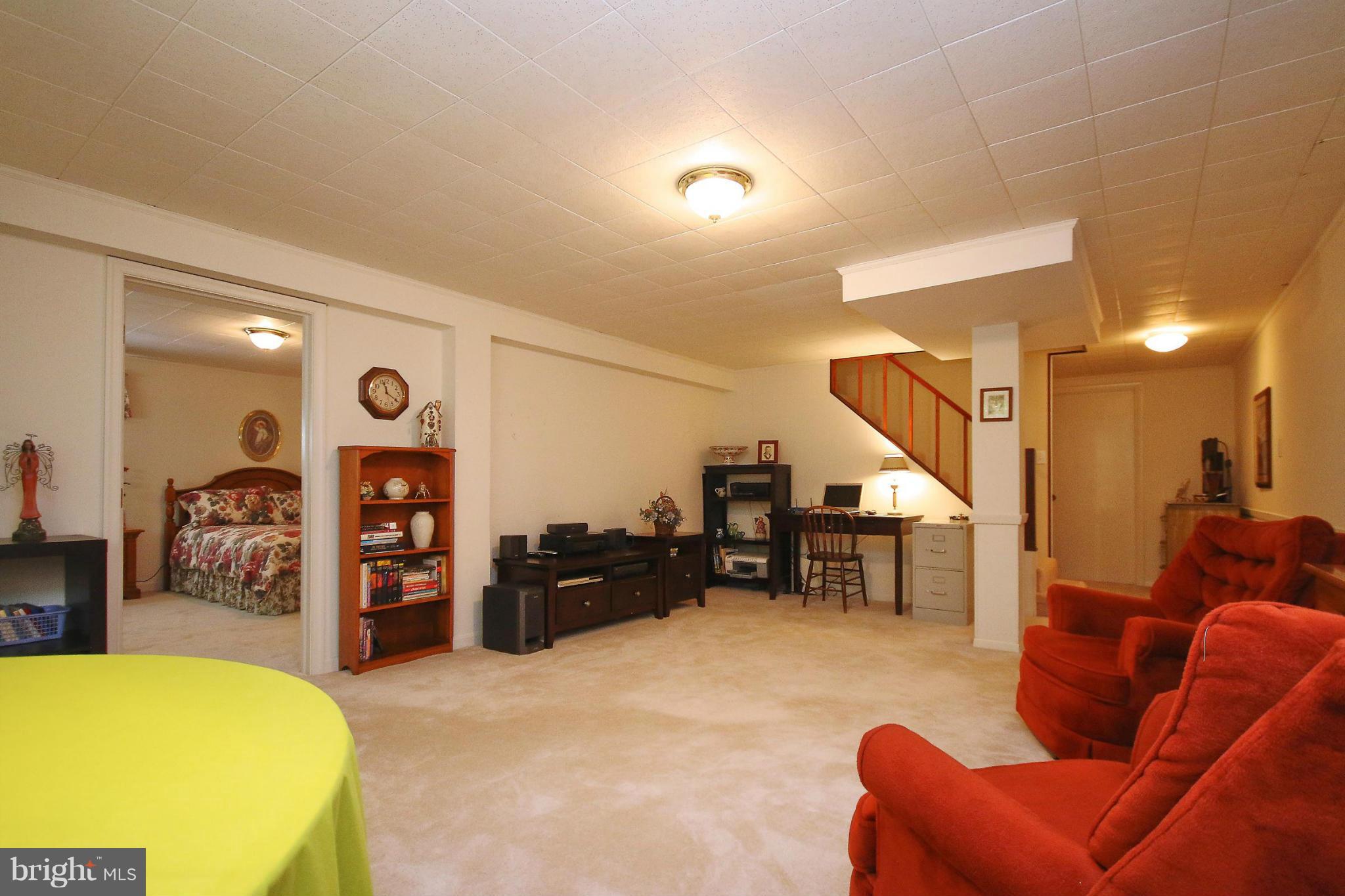 7927 Ellet Road Springfield, VA 22151 - Photo 22 of 30 a living room with furniture and a flat screen tv