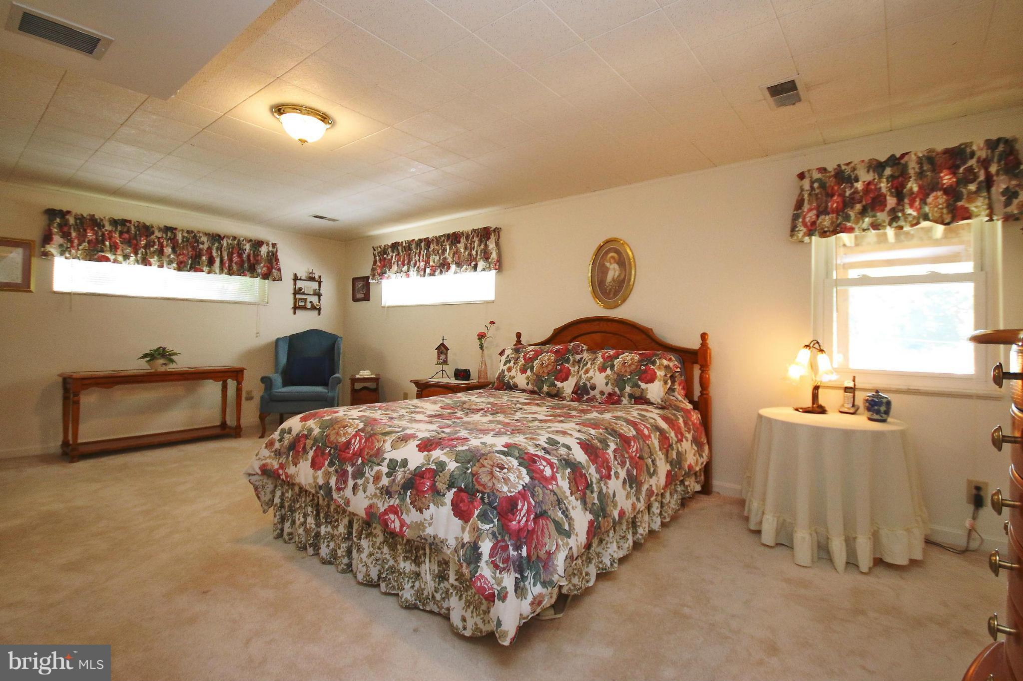 7927 Ellet Road Springfield, VA 22151 - Photo 23 of 30 a bedroom with bed and a window