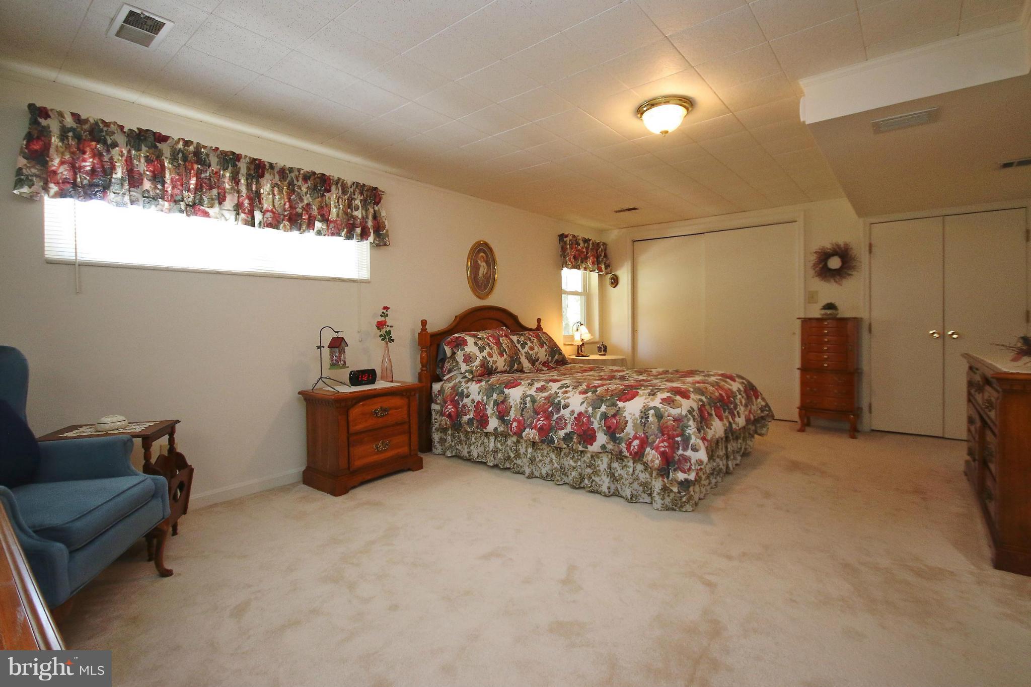 7927 Ellet Road Springfield, VA 22151 - Photo 24 of 30 a bed room with a bed and a couch