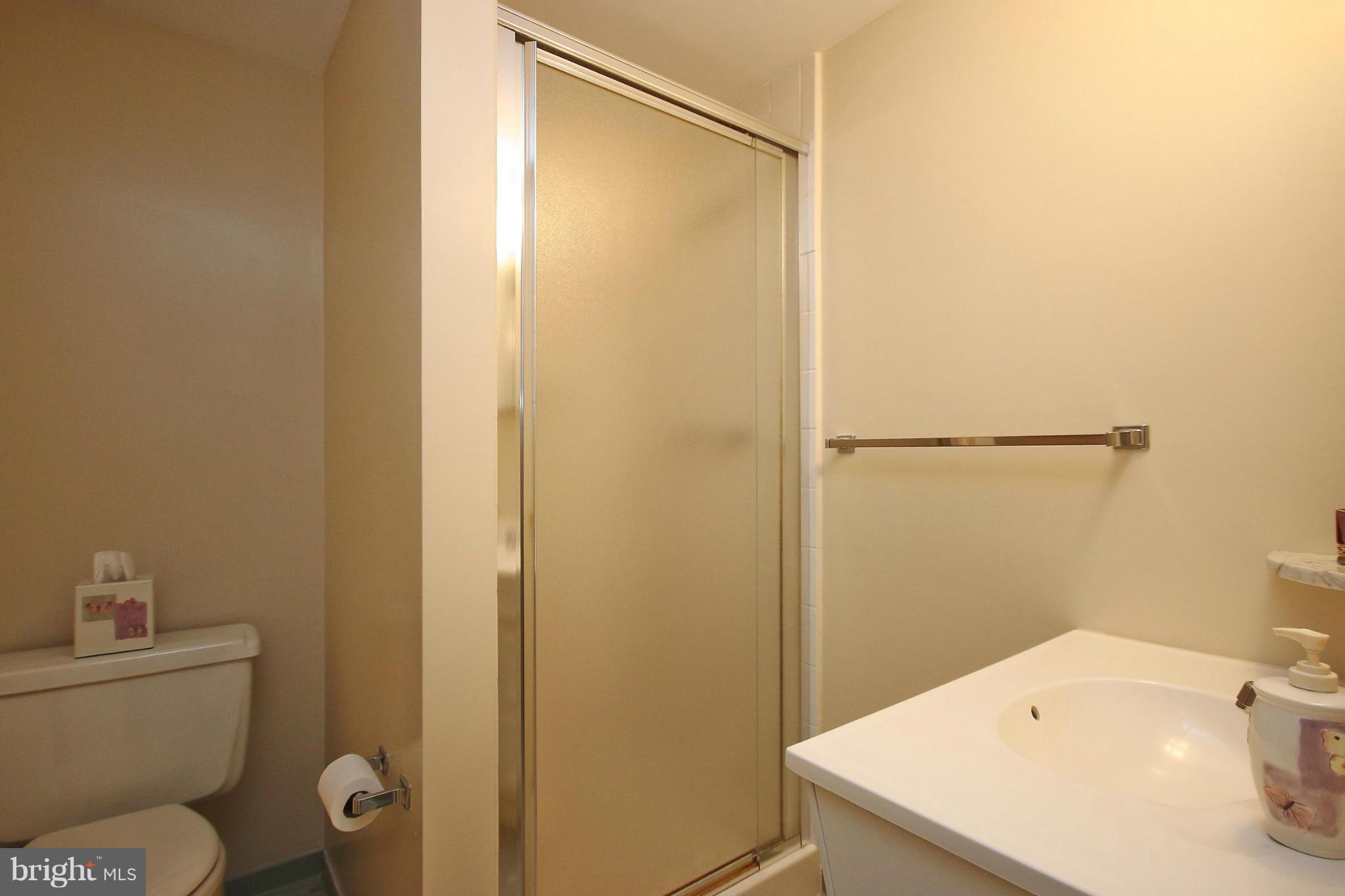 7927 Ellet Road Springfield, VA 22151 - Photo 25 of 30 a bathroom with a sink a toilet and shower