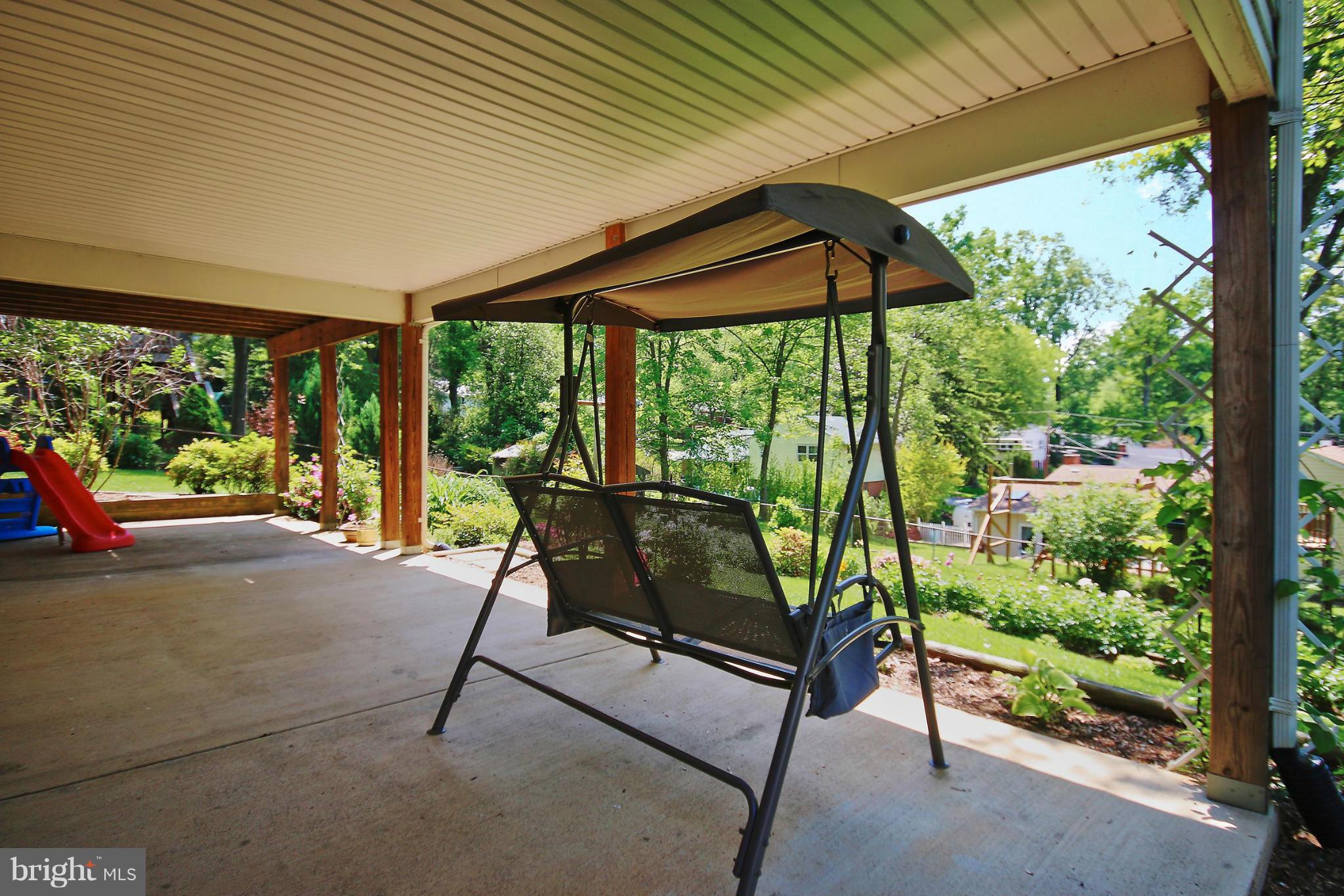 7927 Ellet Road Springfield, VA 22151 - Photo 28 of 30 a view of a two chairs in the street next to a yard