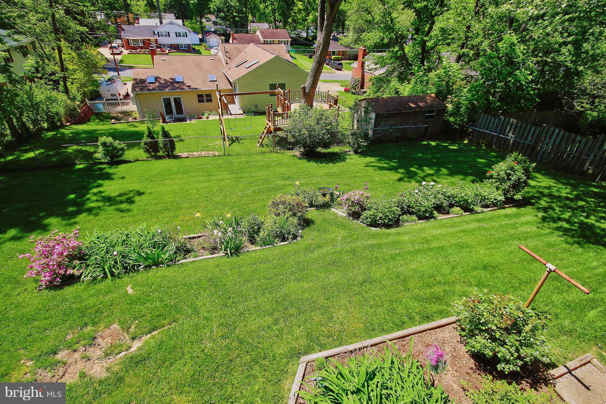 7927 Ellet Road Springfield, VA 22151 - Photo 30 of 30 a view of backyard with garden and car parked