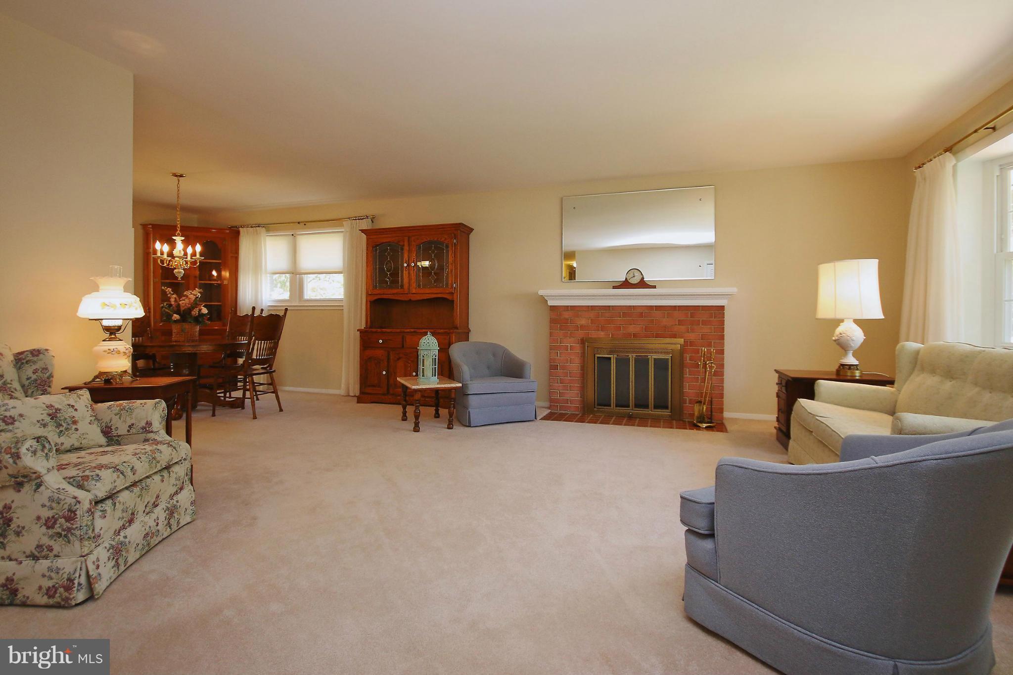 7927 Ellet Road Springfield, VA 22151 - Photo 5 of 30 a living room with furniture and a fireplace