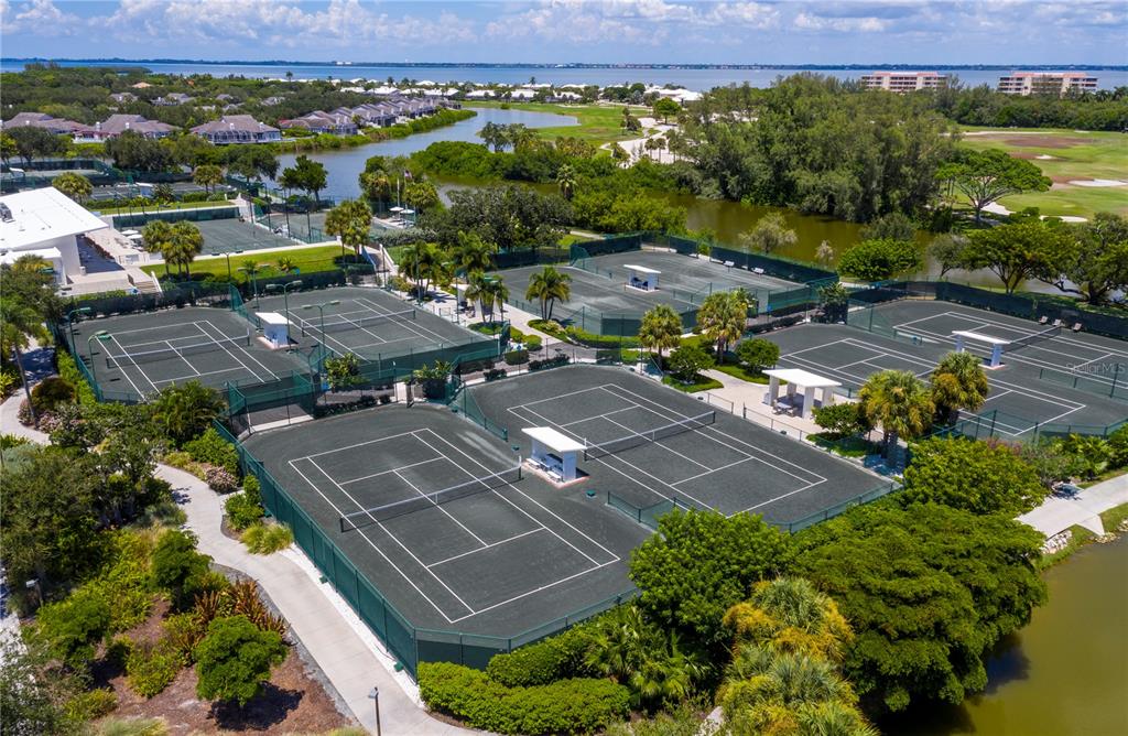455 Longboat Club Road, Unit 402 Longboat Key, FL 34228 - Photo 47 of 48 an aerial view of multiple houses with yard