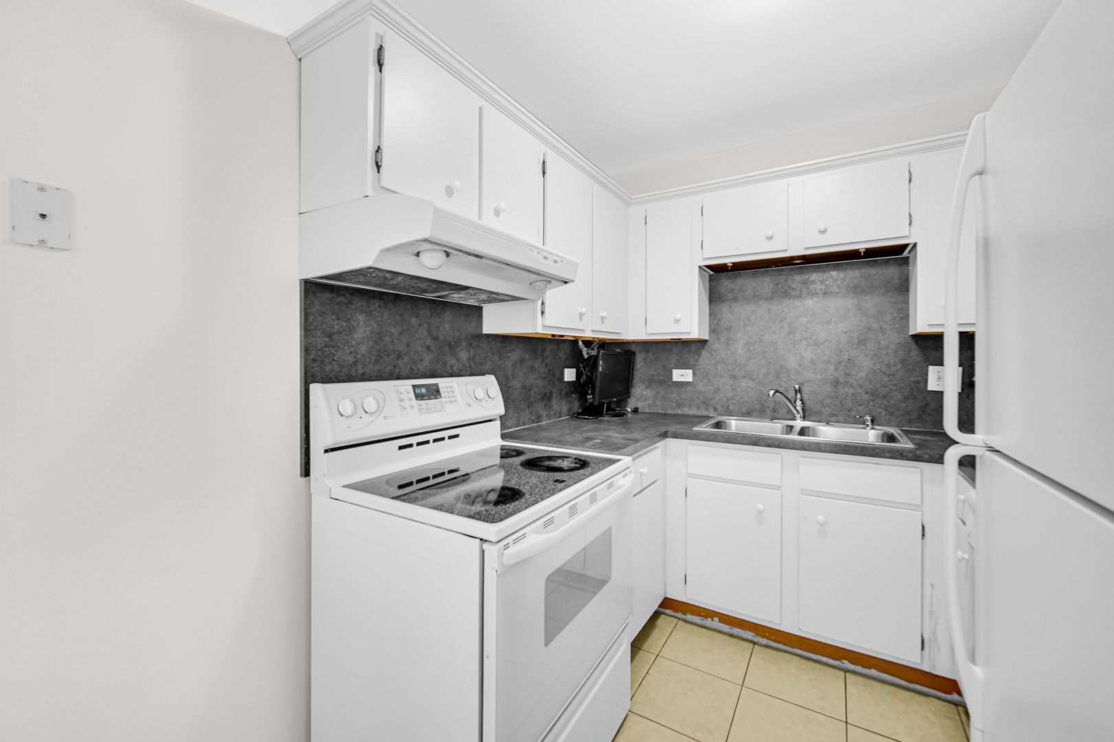 2600 Light Road, Unit 209 Oswego, IL 60543 - Photo 6 of 15 a kitchen with white cabinets sink and white appliances