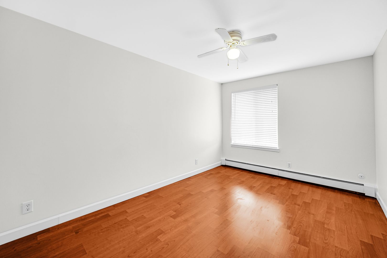 2600 Light Road, Unit 209 Oswego, IL 60543 - Photo 8 of 15 an empty room with a window and a ceiling fan