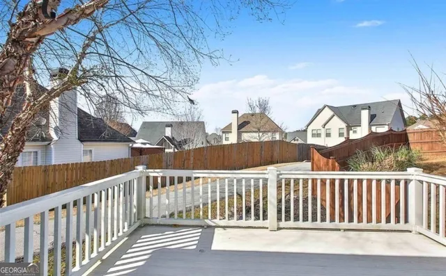 a view of a houses from a balcony