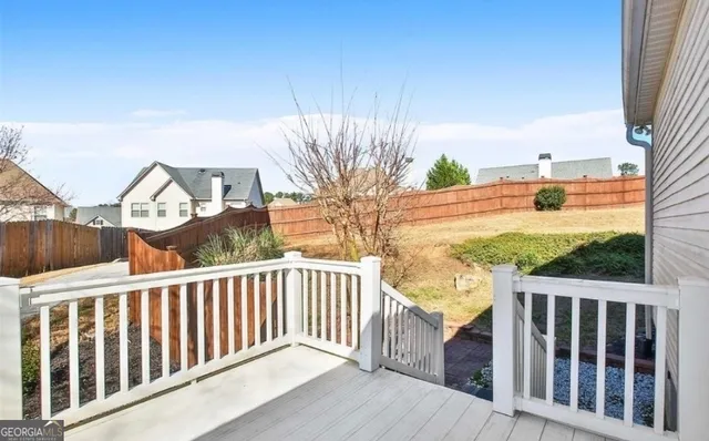 a view of a balcony with wooden floor