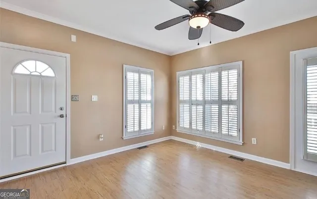 a view of an empty room with a window
