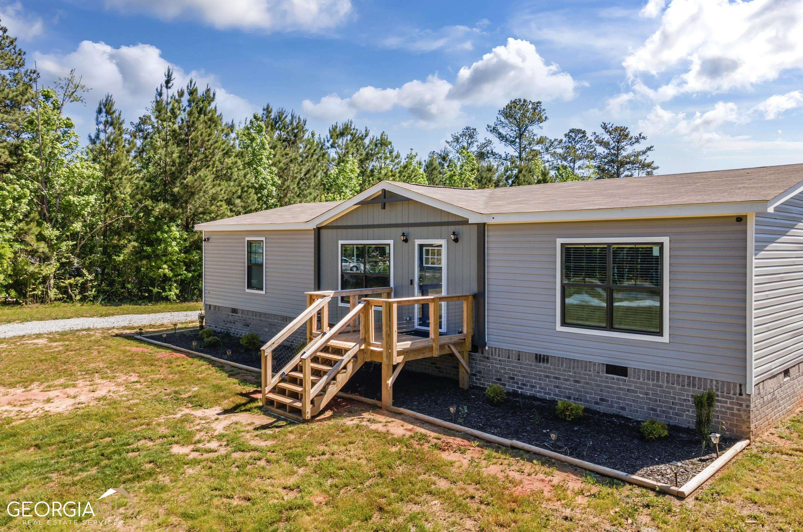 151 Lepard Road Waco, GA 30182 - Photo 1 of 1 a view of backyard with a patio