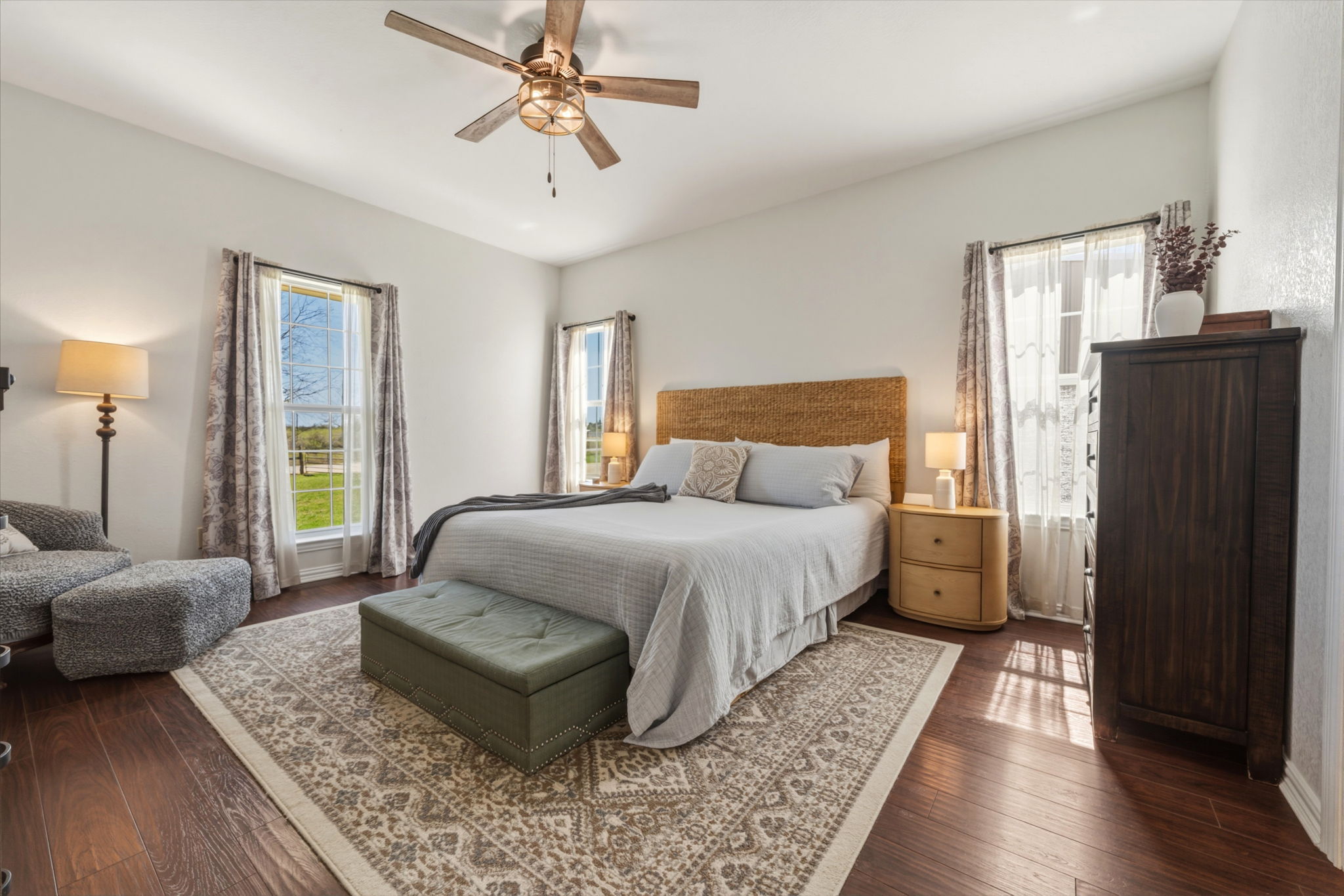 1516 Old Luling Road Lockhart, TX 78644 - Photo 11 of 39 Bedroom featuring wood-style floors, sitting area and ceiling fan