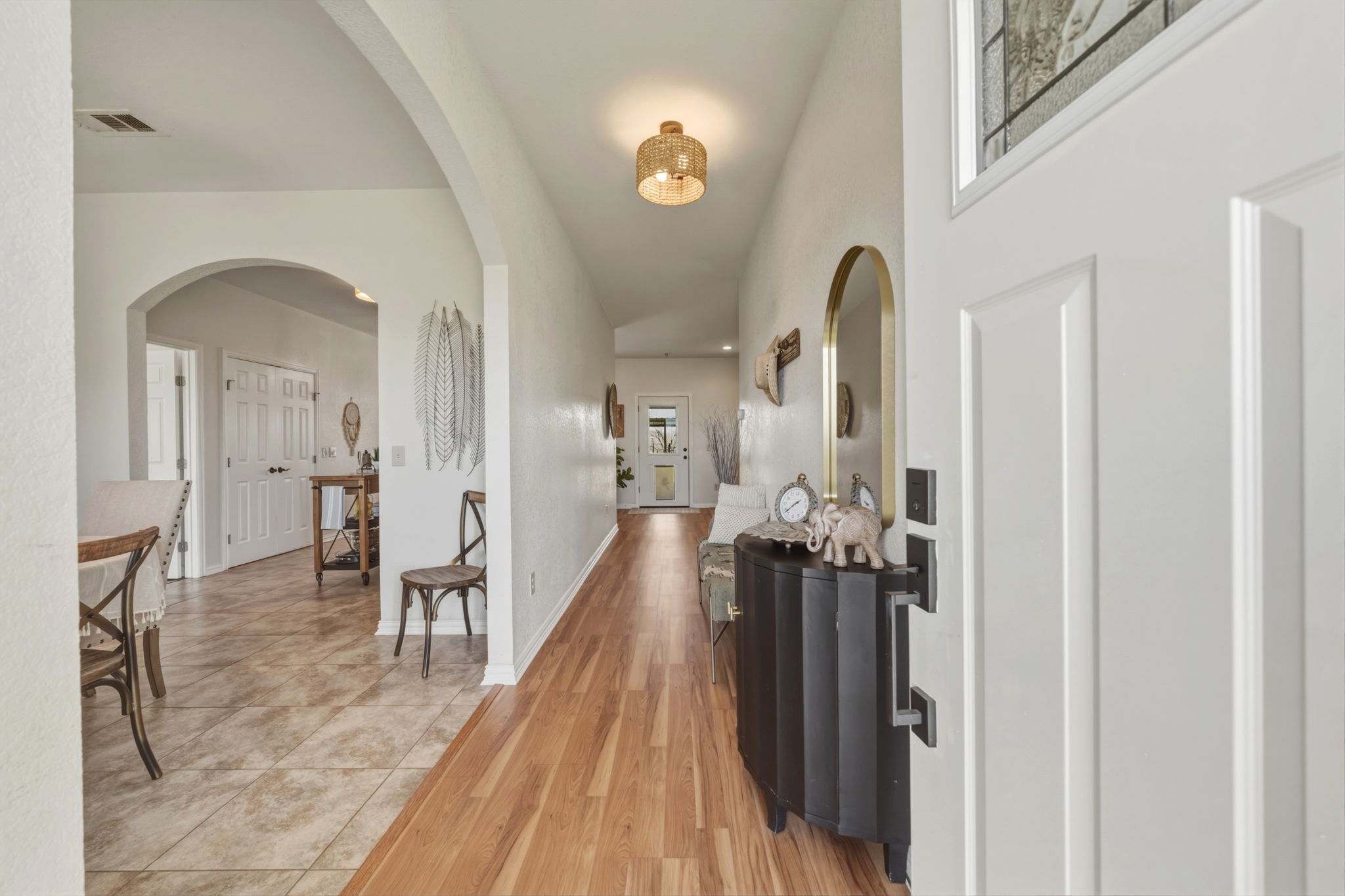 1516 Old Luling Road Lockhart, TX 78644 - Photo 2 of 39 Entry with arched walkway to Formal Dining and light wood-type flooring