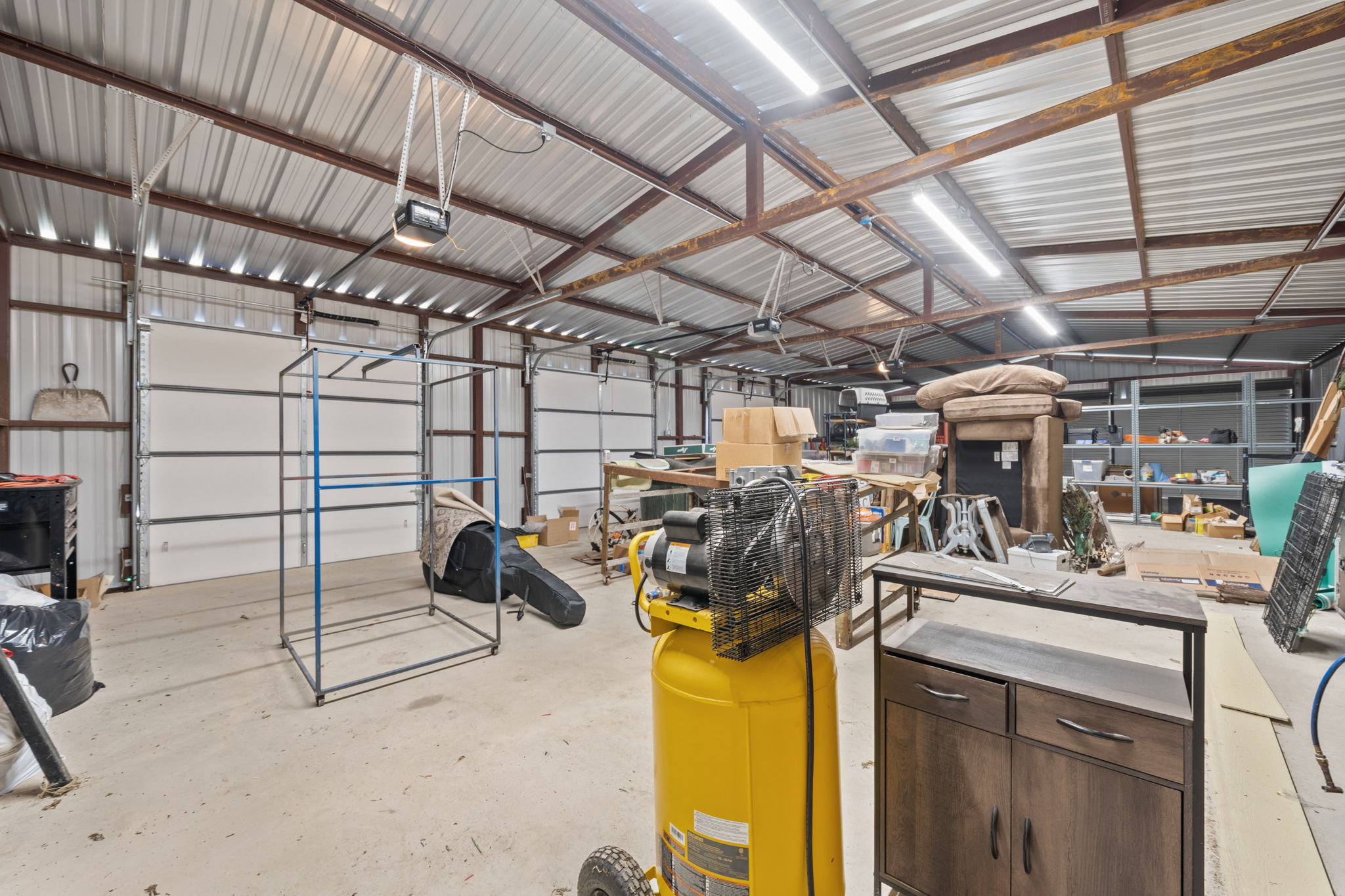 1516 Old Luling Road Lockhart, TX 78644 - Photo 26 of 39 Garage featuring 3 garage doors with openers