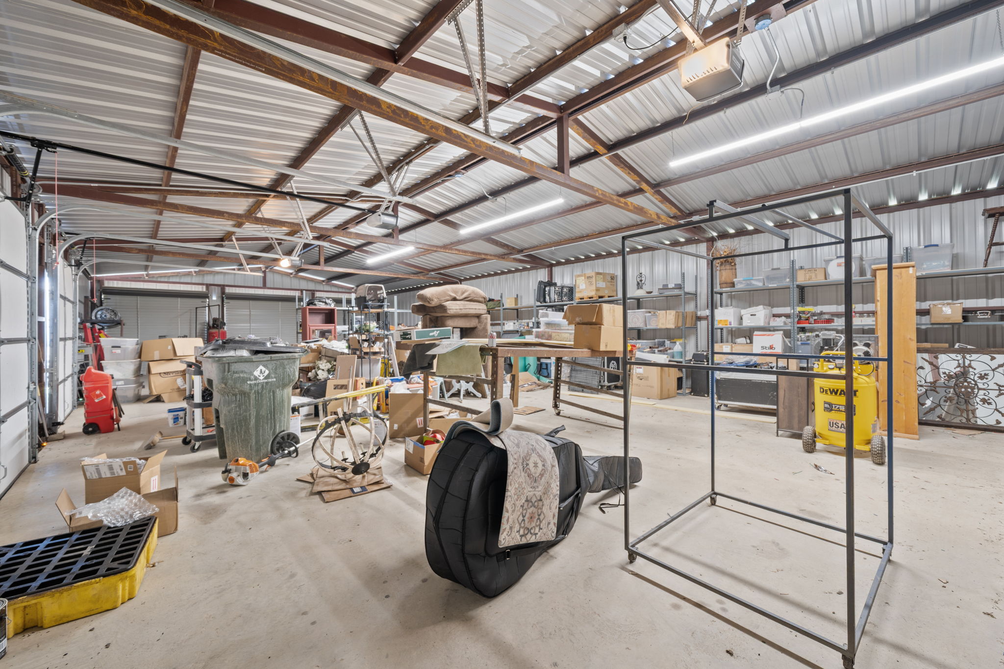 1516 Old Luling Road Lockhart, TX 78644 - Photo 27 of 39 Garage featuring a workshop area and roll up doors