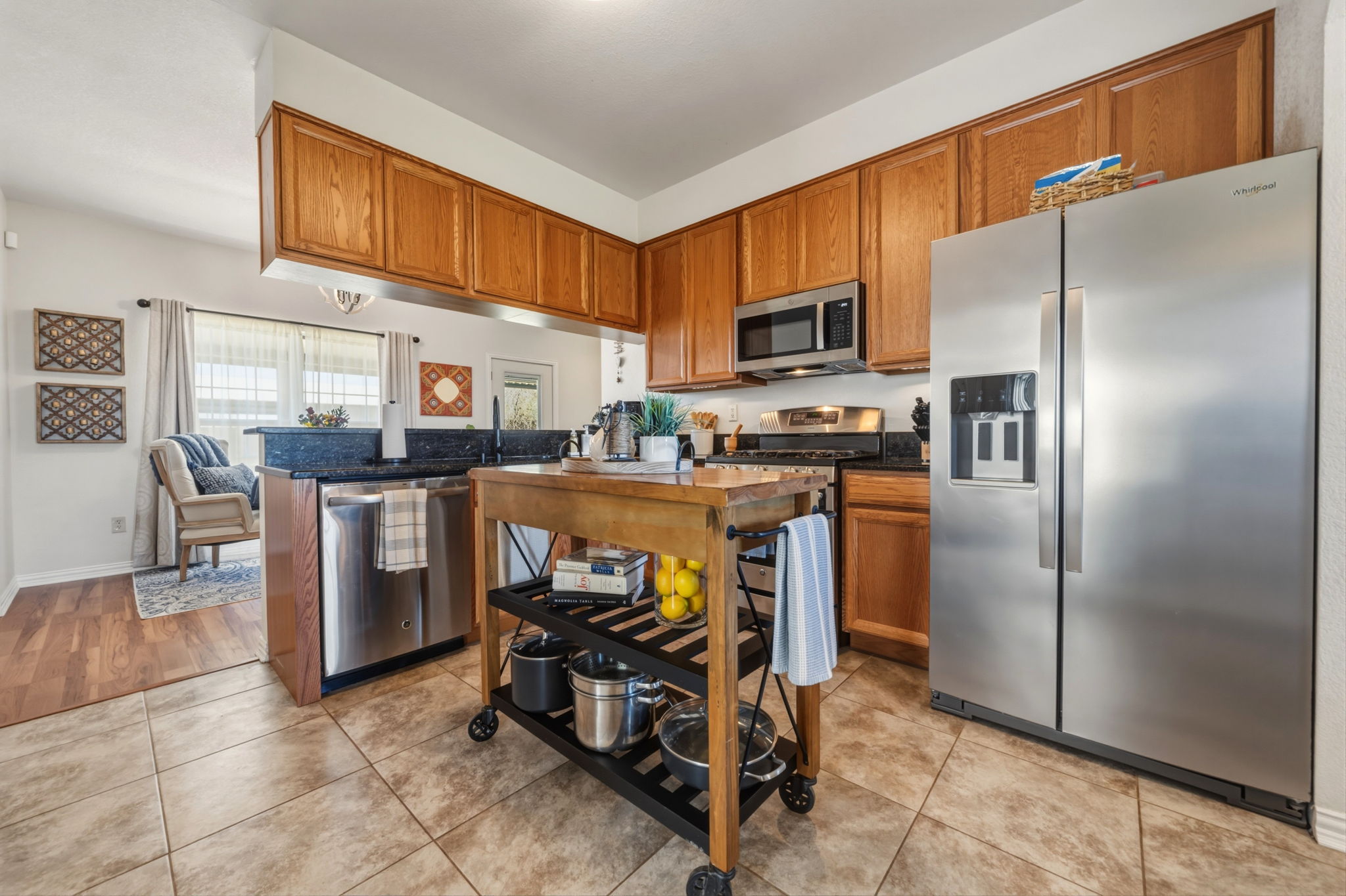 1516 Old Luling Road Lockhart, TX 78644 - Photo 5 of 39 Kitchen with stainless steel appliances, wood finish cabinets, open to the Breakfast Area