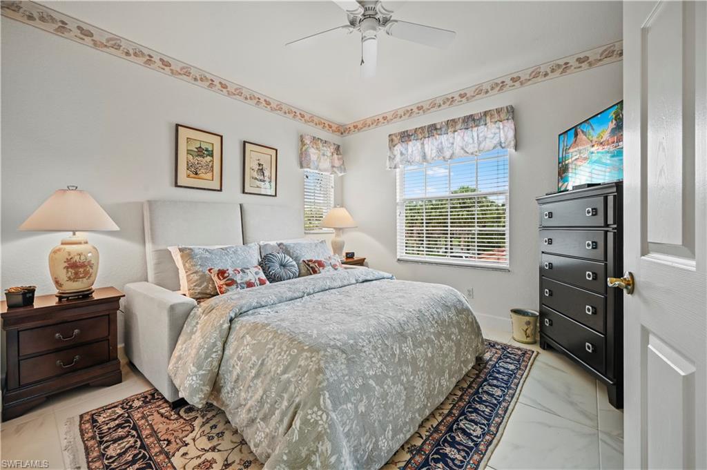 23741 Old Port Road, Unit 204 Estero, FL 34135 - Photo 17 of 46 a bed room with a bed and a window